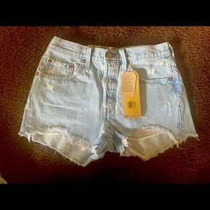 Levi’s 501 high waisted/distressed shorts. 27